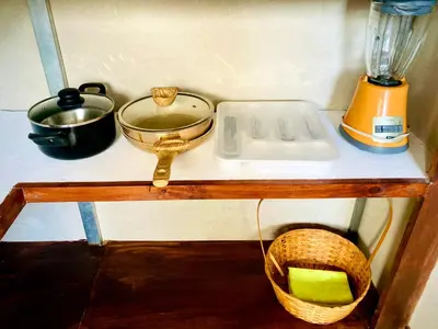 a counter top with a blender and a basket on it at Nomads Family Rooms, Fortuna Town in Fortuna