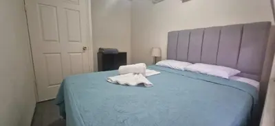 a room with a bed with a towel on it at La casa del volcán in Fortuna