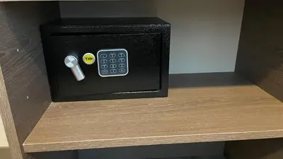 a black box with a remote control on a shelf at Cozy apartment with terrace, SJ Cosmopolitan Tower #402 in San José