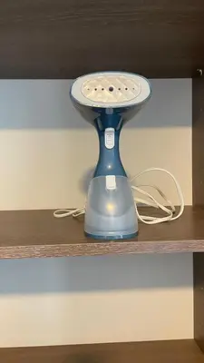 a blue remote control sitting on a shelf at Cozy apartment with terrace, SJ Cosmopolitan Tower #402 in San José