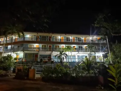 a hotel at night with the lights on at Hotel Ticozuma in Montezuma