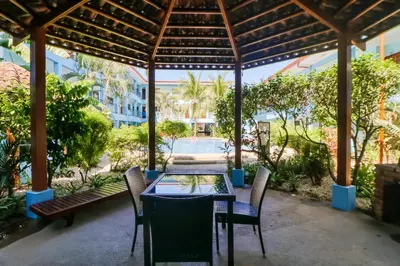 a table and chairs under a pavilion on a patio at Marina Loft 221 in Coco