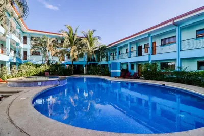 a large swimming pool in front of a building at Marina Loft 221 in Coco