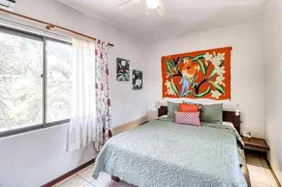 a bedroom with a bed and a window at Marina Loft 221 in Coco