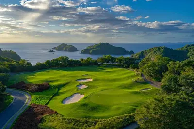 an aerial view of a golf course with the ocean at Villaggio Claudia 29B in Potrero