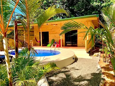 a small swimming pool in front of a house at Ocean Melody 4 in Uvita