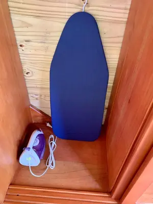 a blue surfboard sitting on top of a wooden floor at Ocean Melody 4 in Uvita