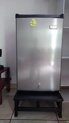 a large metal appliance with a sign on it at Hospedaje Rio Celeste Katira, Habitación privada in San Rafael