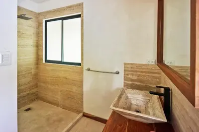 a bathroom with a sink and a window at Villa Ananda in Mal País