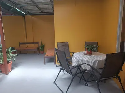 a table and chairs in a room with a table and a table and chairsktop at Apartamentos M&M in Fortuna