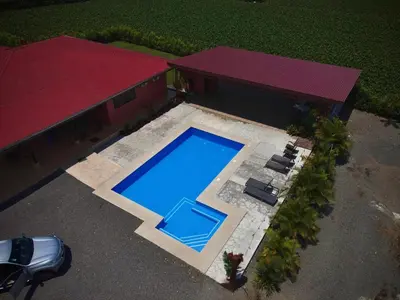 an overhead view of a swimming pool in front of a house at Casa Stela in Fortuna