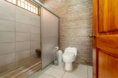 a bathroom with a toilet and a shower at Casa Stela in Fortuna