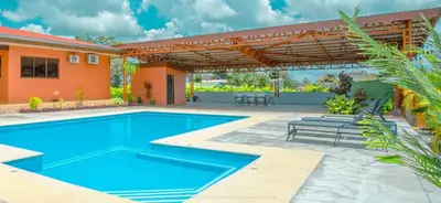 a swimming pool in the backyard of a house at Casa Stela in Fortuna