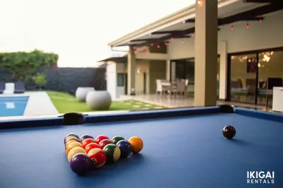 a pool table with balls on top of it at Jm House in Alajuela City