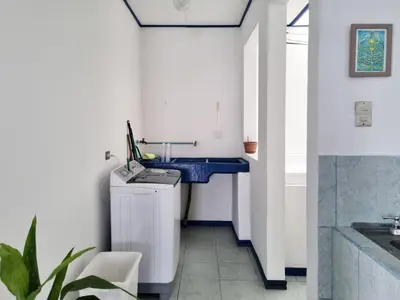 a bathroom with a blue sink and a counter at Entire Homy apartment for you, 5 min SJO Airport in Alajuela City