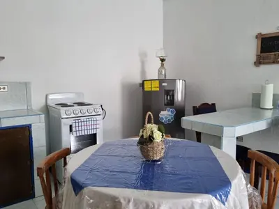 a kitchen with a table with a basket on it at Entire Homy apartment for you, 5 min SJO Airport in Alajuela City