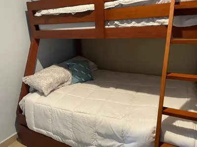 a bunk bed with a pillow on top of a bunk bed at Bejuco Beachfront Condo FRENTE A LA PLAYA hermoso condominio NUEVO in Esterillos Este