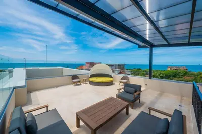 a view from the balcony of a house at Tropical Luxury 2Bdr condo - Pool view - At the Beach in Tamarindo