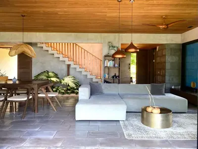 a living room with a couch and a table at THEA Resort & Retreats - Santa Teresa in Santa Teresa Beach