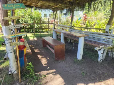 a picnic table and bench in a park at Villas Playa Palo Seco in Parrita
