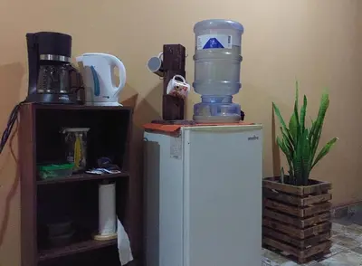 a water bottle sitting on top of a refrigerator at Hospedaje Doña koko in Puerto Limón