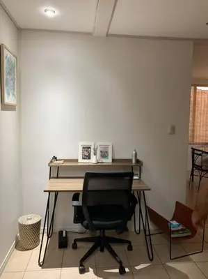 an office with a desk and a chair in a room at Casa Buda Liberia Cerca del Aeropuerto in Liberia