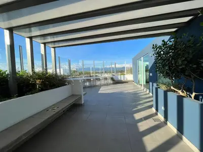 a balcony of a building with a view of the city at Bambu-Rivera Club Residences in San José