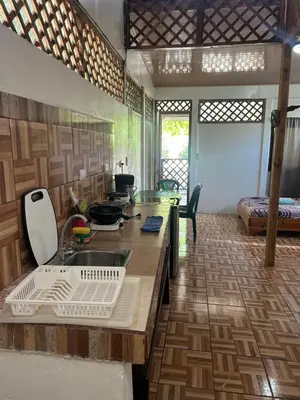 a kitchen with a sink and a counter top at Ballena Oasis Homes & Glamping in Uvita