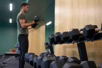 a man standing in front of a row of chairs at Cosmopolitan APT 1407, 5 Star Facilities, 15m SJO Airport, Parking, Pool, Gym in San José