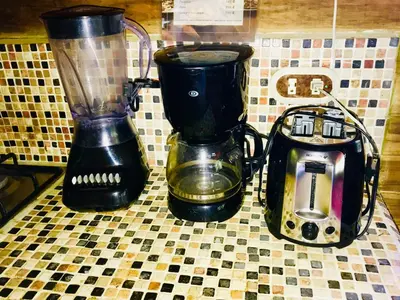 two blenders sitting on a counter next to a blender at Anam Apartments in Santa Teresa Beach