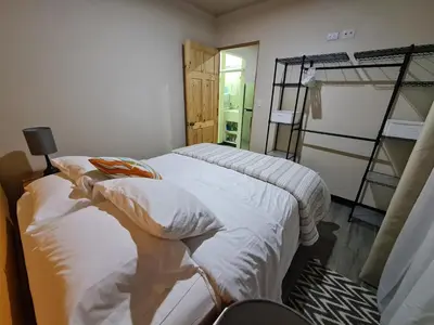 a bedroom with two beds and a bunk bed at Fully-equipped 2-bedroom apartment in San José in San José