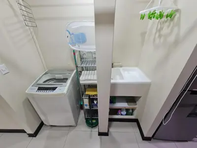 a small refrigerator with a sink in a room at Fully-equipped 2-bedroom apartment in San José in San José