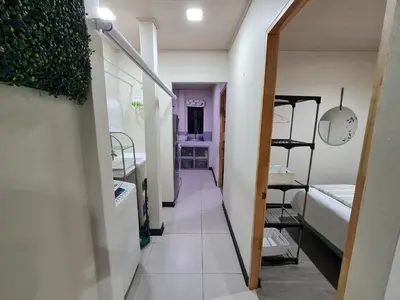 a hallway leading to a room with a bunk bed at Fully-equipped 2-bedroom apartment in San José in San José