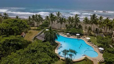 an aerial view of a resort with a swimming pool and the beach at Casa Lapa Oceanside Villa in Playa Hermosa