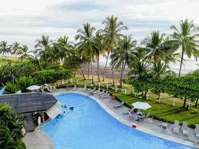 an overhead view of the pool at the beach resort at Casa Lapa Penthouse Oceanside Villa in Playa Hermosa