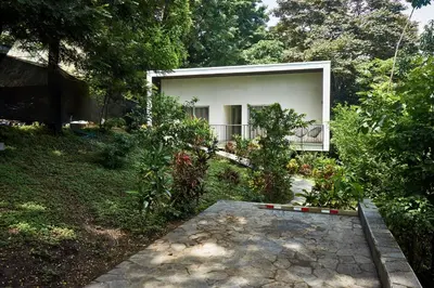 a house with a walkway in front of it at Villa Venus in Santa Teresa Beach