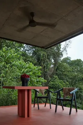 a table and two chairs sitting on a patio at ACHIOTÉ Architectural Gem - Adults Only in Uvita