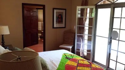 a bedroom with a bed and a room with a window at Unique 5 Architectural Homes, Pool & Wi-Fi in Lagunillas