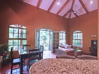 a large room with a large bed and a living room at 3 Architectural Homes, Wi-fi and Pool in Lagunillas