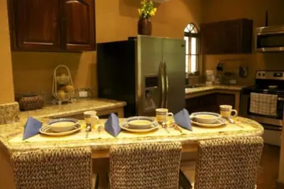 a kitchen with a table with plates on it at 3 Architectural Homes, Wi-fi and Pool in Lagunillas