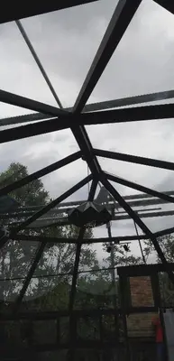 a view from the inside of a glass roof at Cristal House Mountain View in Heredia