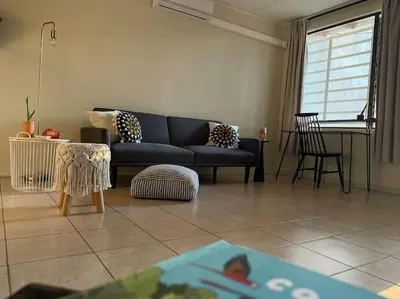 a living room with a couch and a table at Casa Buda 2 Liberia cerca del aeropuerto in Liberia