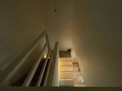 a staircase in a house with a stair case at Casa Buda 2 Liberia cerca del aeropuerto in Liberia