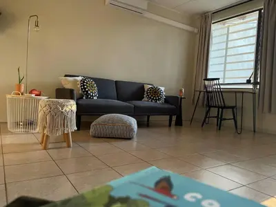 a living room with a couch and a table at Casa Buda 2 Liberia cerca del aeropuerto in Liberia