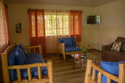 a living room with a couch and chairs and a table at Green House in Samen