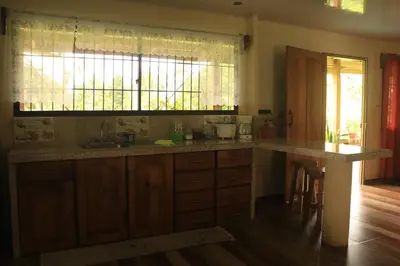 a kitchen with a counter and a sink and a window at Green House in Samen