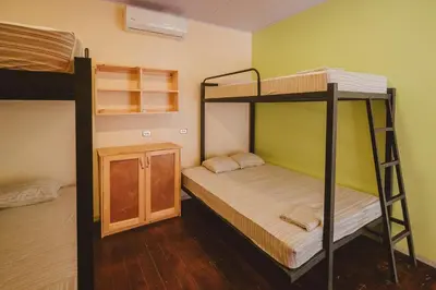 a room with two bunk beds in a room at Habitat Surf Glamp in Santa Teresa Beach