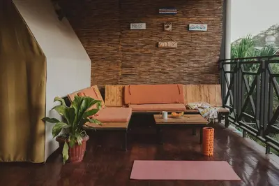 a living room with a couch and a table at Habitat Surf Glamp in Santa Teresa Beach