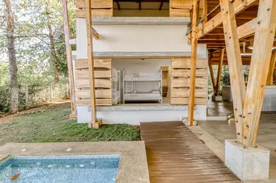a house with a kitchen and a swimming pool at Mangue House in Playa San Miguel