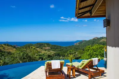 a view of the ocean from the balcony of a villa at Luxury Home with Views and Infinity Pool Near Beach! in Puerto Viejo